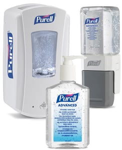 2 wall mounted Purell dispensers and a Purell desktop bottle